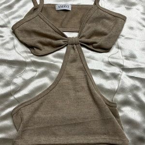 Perfect Staple Vacation Top!!! Knitted Material with cut out details on sides!